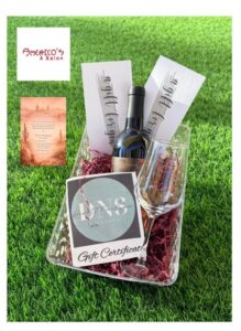 Pamper Yourself Basket: $50 gift card to Hair by Angela at Americo's Salon, $30 skin care service gift card at Americo's Salon, Desert Nails Spa gift card, 75 min reflexology treatment, bottle of wine, wine glass